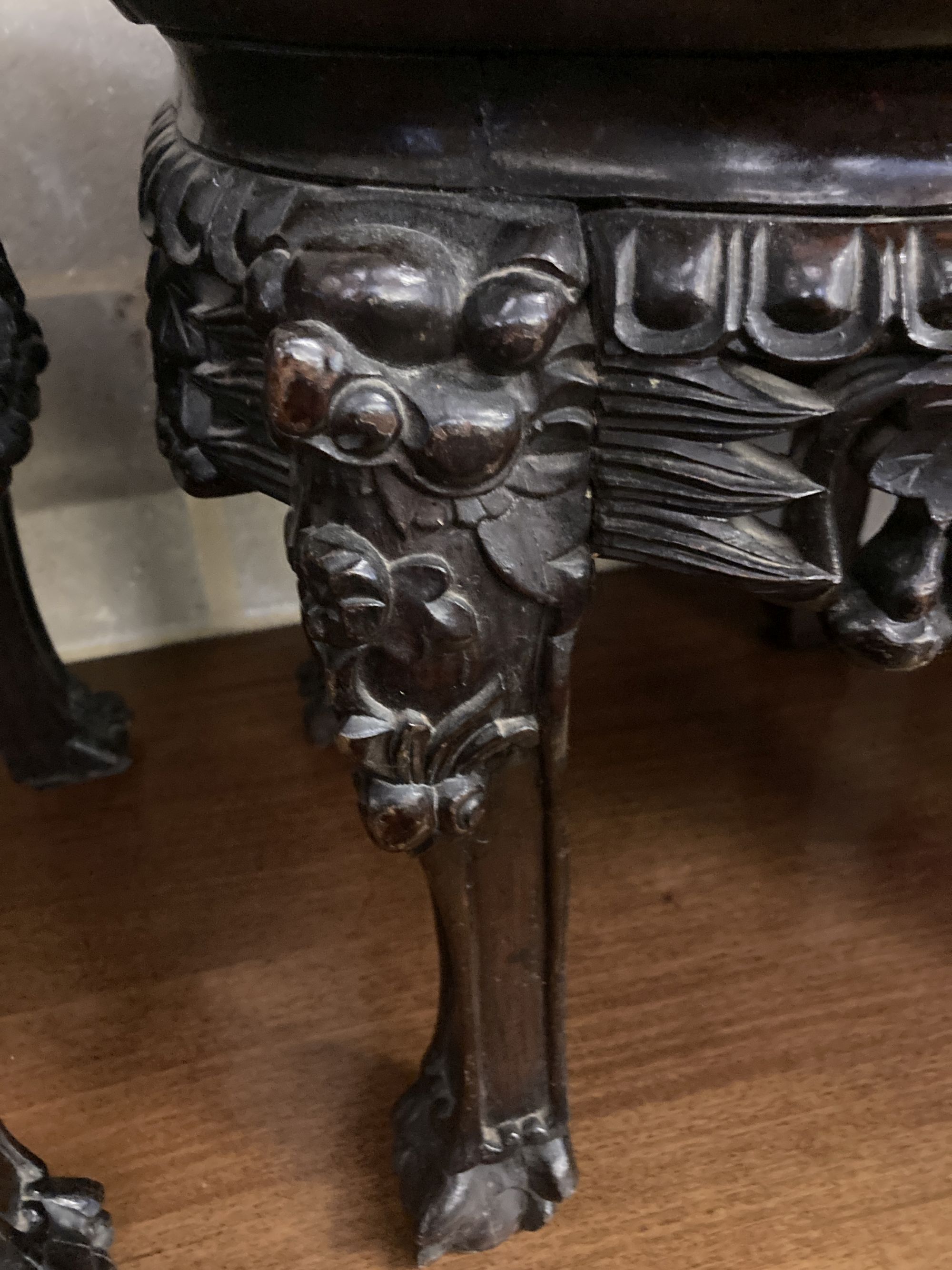 A pair of circular Chinese carved hardwood jardiniere stands, with rouge marble inset tops, 38cm diameter, height 38cm